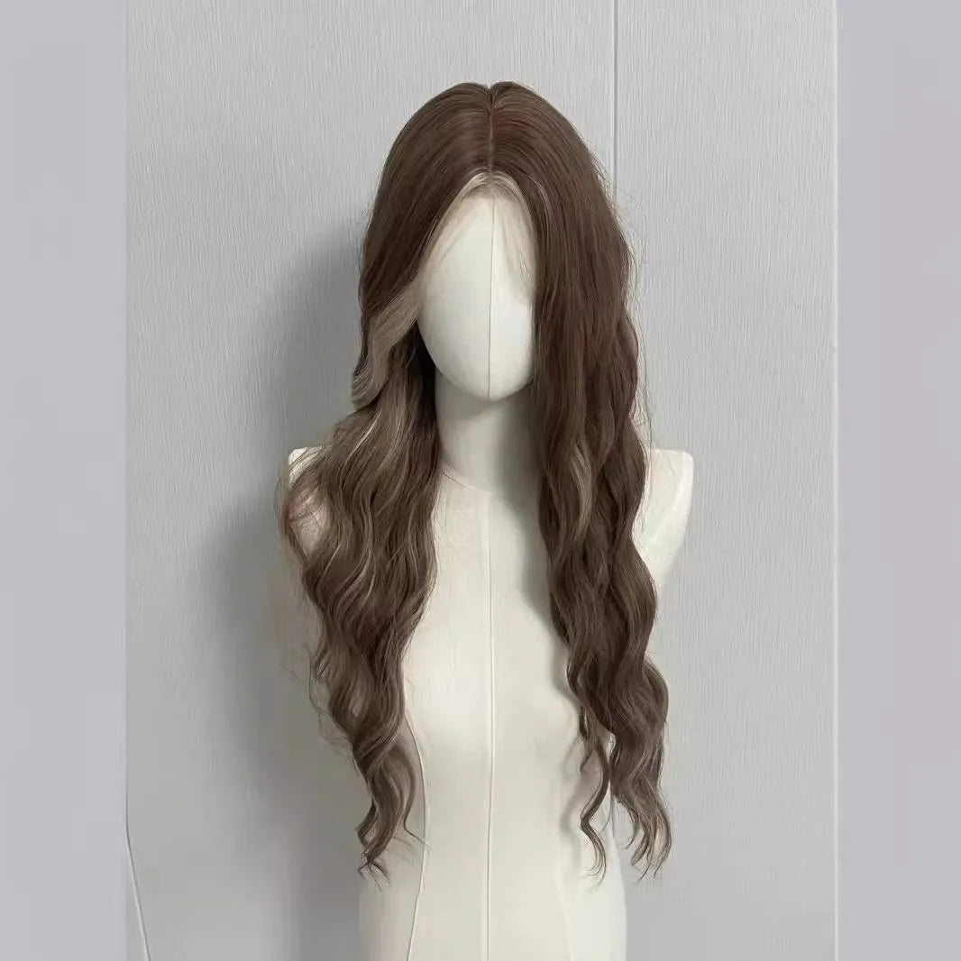 A long curly synthetic wig in a lace grey gold colour on a mannequin head.