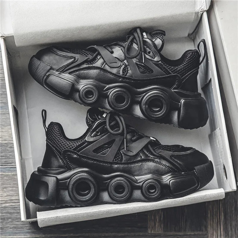 Men's black mesh sneakers with thick rubber soles and round toe design