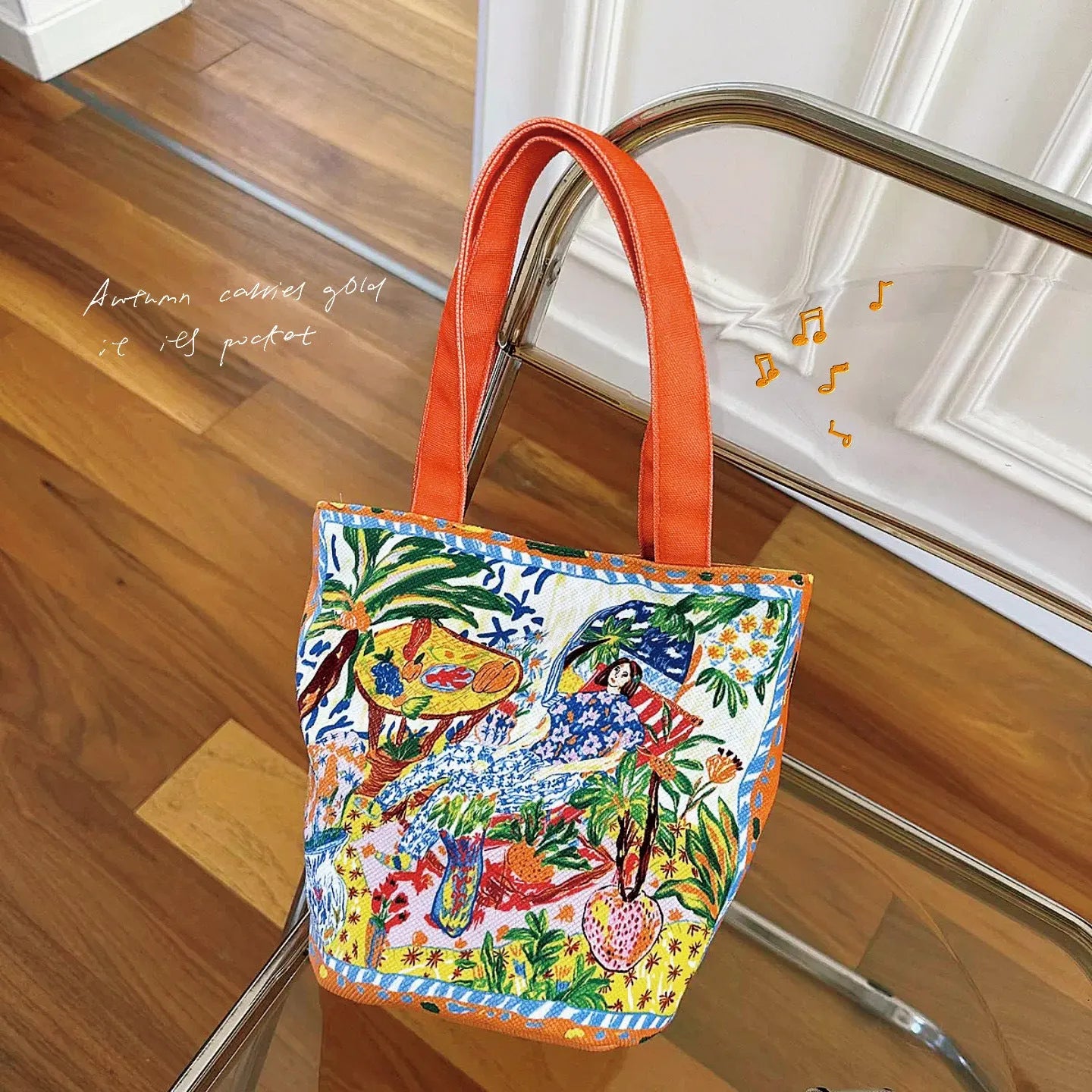 Dream Garden orange plush canvas Thailand artistic bucket bag with double straps and printed details.