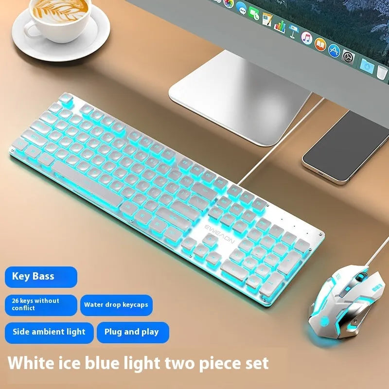 Wired mute computer keyboard with mechanical feel in Metal Black colour with blue backlighting on a desk.