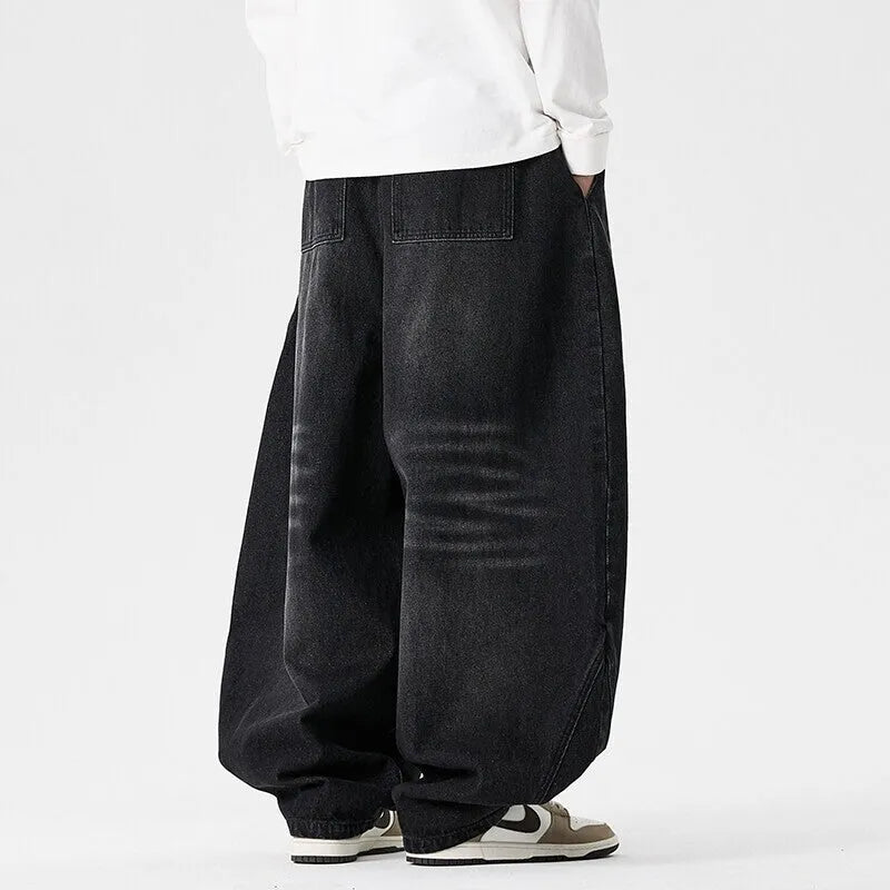 Men's plus size wide leg jeans in denim fabric with straight leg openings and low waist design