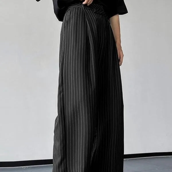Black men's casual trousers with vertical stripes and front pleats laid flat.