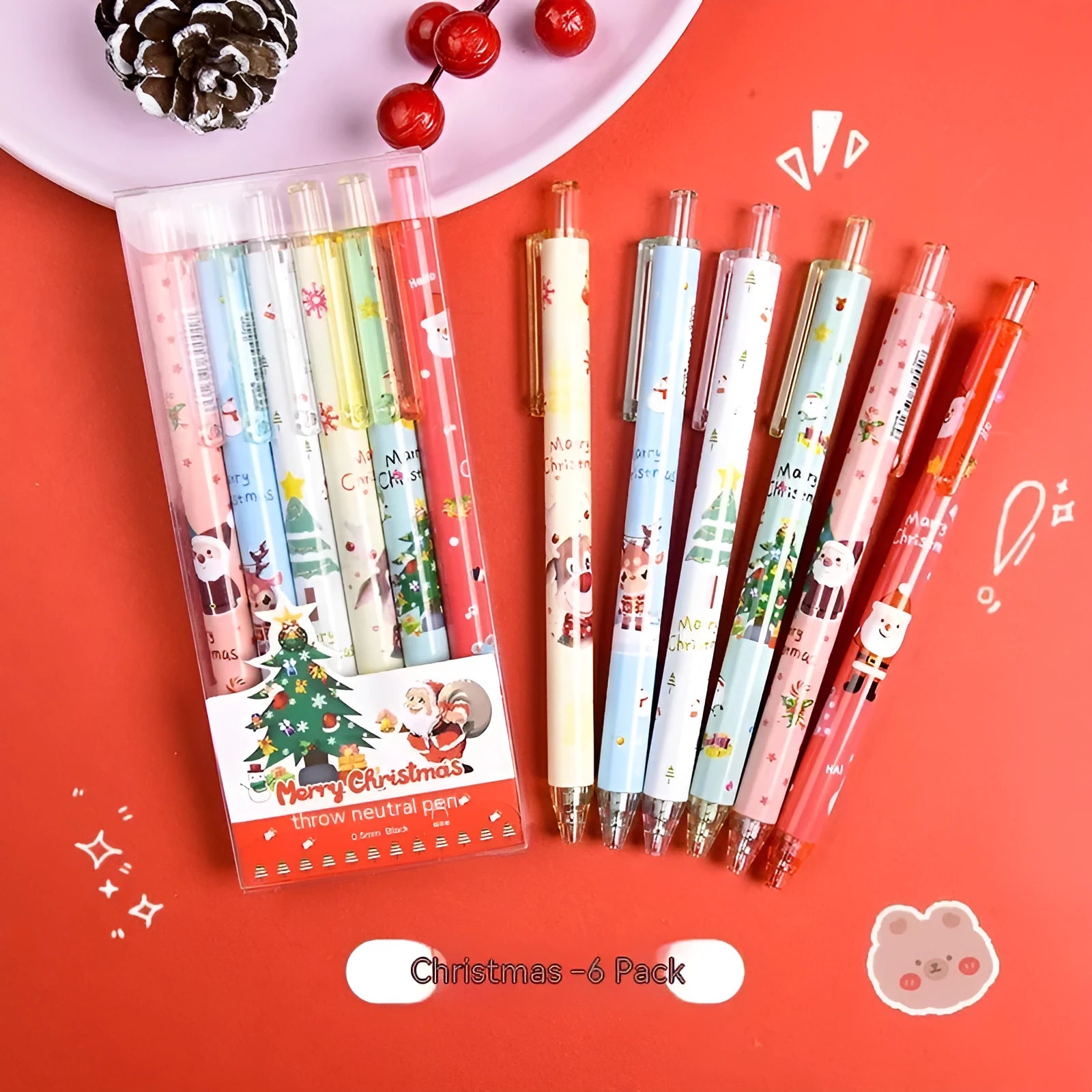 Six colourful cartoon press gel pens with black ink in plastic shells as Christmas gift set
