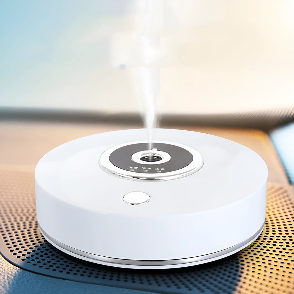 USB-powered plastic car aromatherapy spray machine in black, grey, or white on a car dashboard.