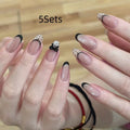 Medium length coffin-shaped fake nails in mixed colours with nail glue and application tools