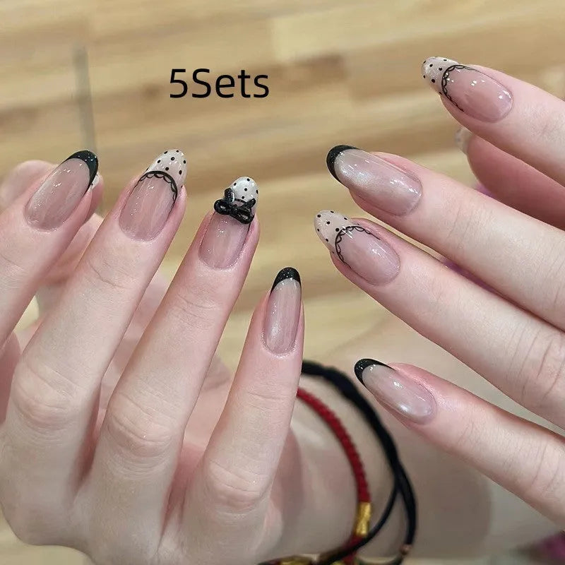 Medium length coffin-shaped fake nails in mixed colours with nail glue and application tools