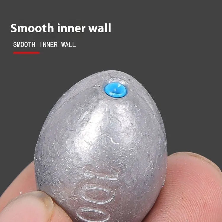 Rugby-shaped olive lead fishing sinker with scale Tongxin pattern, shown alongside weight options from 10g to 150g.