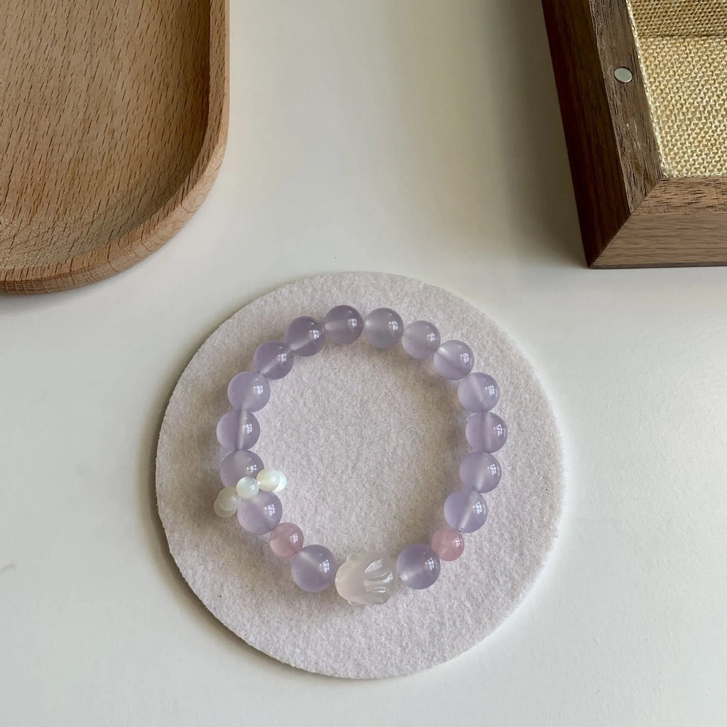 Handmade women's bracelet with a glass band and a choice of rabbit charm, presented in a gift box.