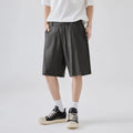 A pair of men's apricot coloured casual shorts made from cotton-blend lyocell fabric, showing a loose fit.