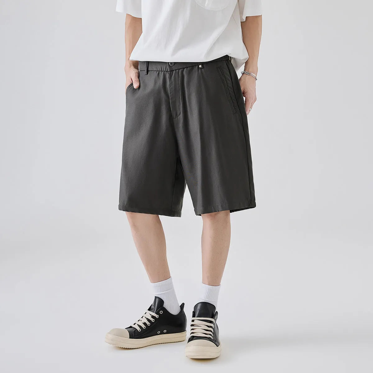 A pair of men's apricot coloured casual shorts made from cotton-blend lyocell fabric, showing a loose fit.