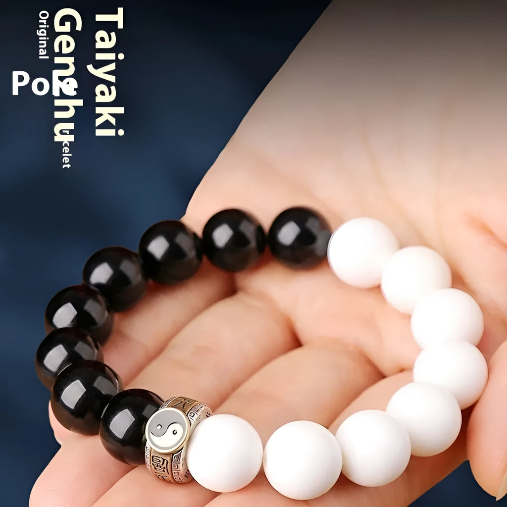 Black and white obsidian bracelet with taiji symbol and mantra bead