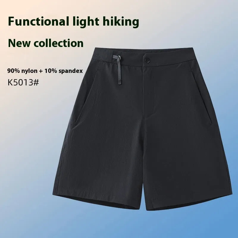 Man wearing solid-colour quick-dry sports shorts with an elastic waistband for running or climbing.