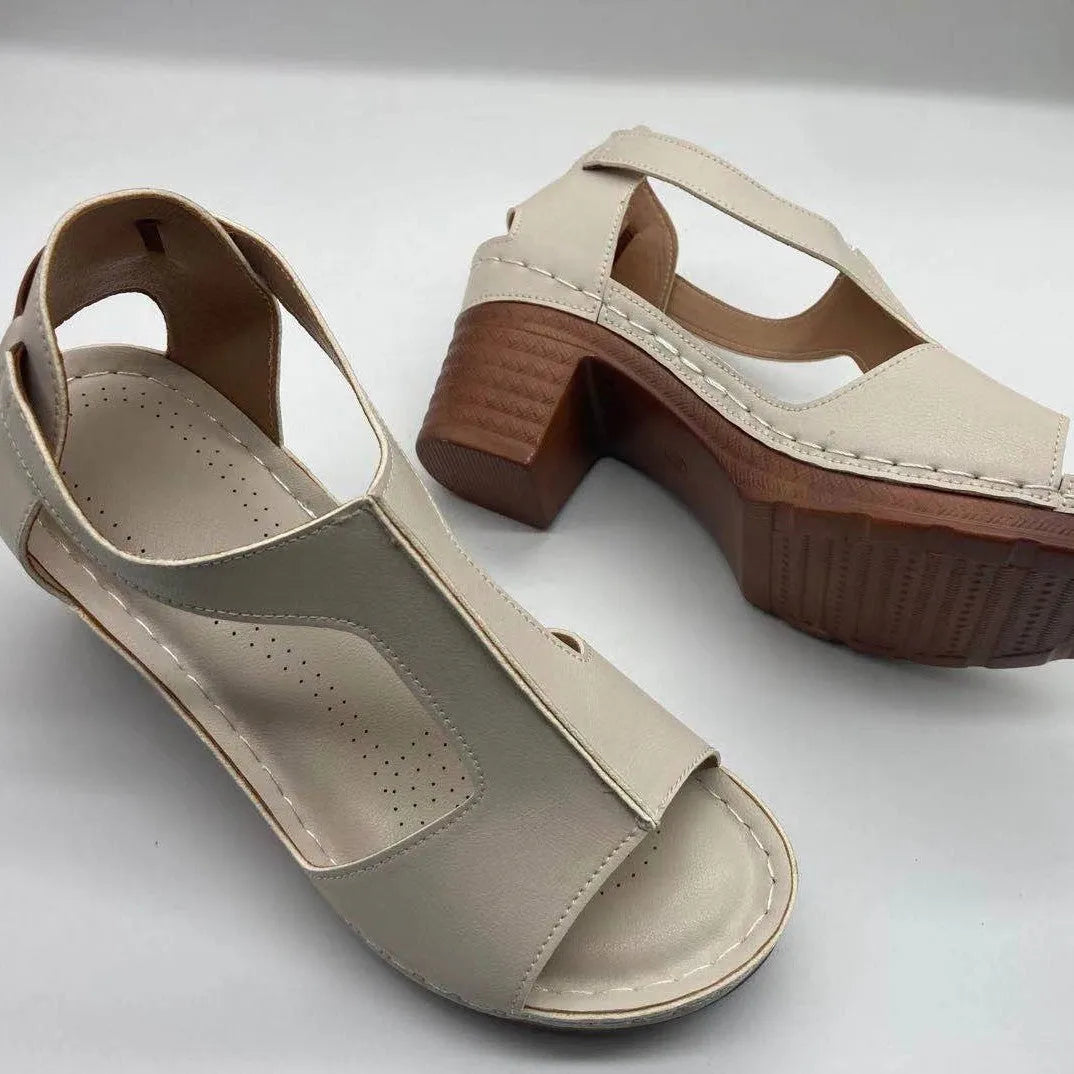 Women's beige peep toe wedge sandals with a buckle strap and low heel