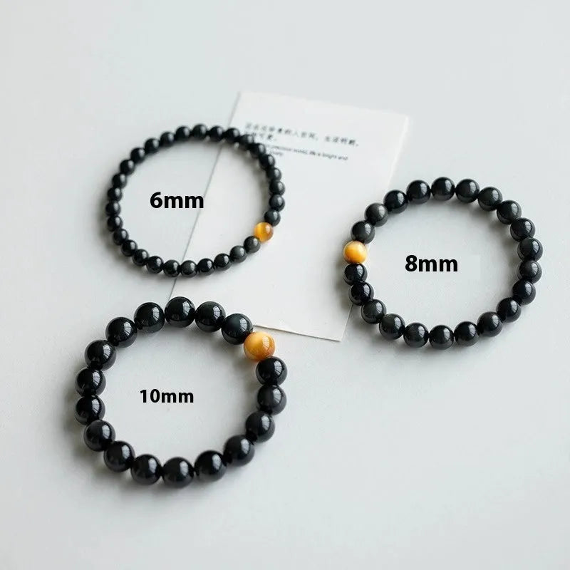 Geometric cut black obsidian stone bracelet showing 6mm, 8mm, and 10mm size beads.