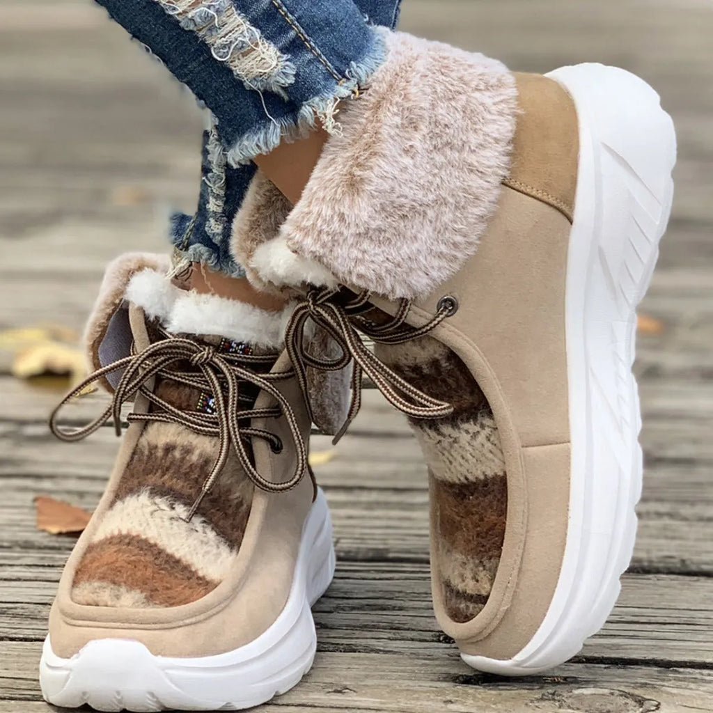 Women's beige lace-up snow boots with fuzzy lining and a thick rubber platform sole