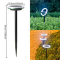 Solar-powered rotating lawn light with 12 LEDs in garden setting