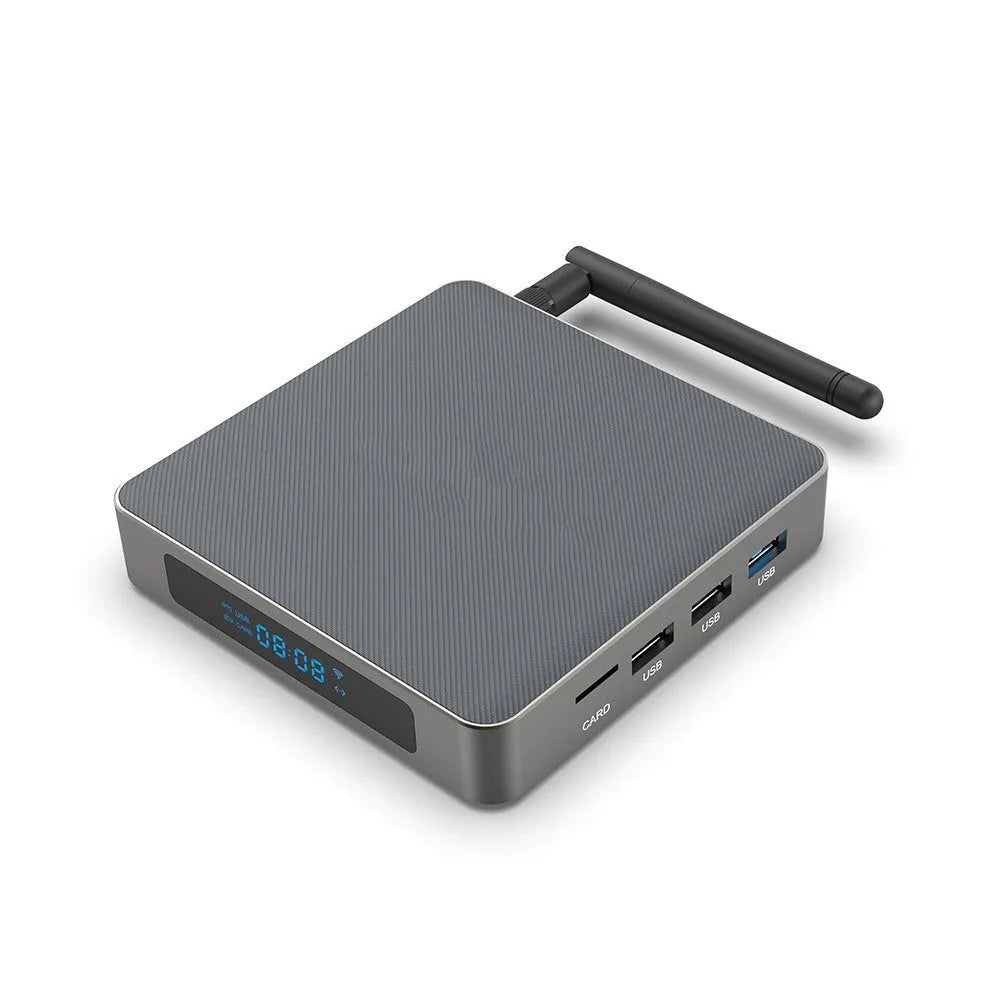 Black Android 8K network set-top box with remote, HDMI cable, and power supply on a wooden surface.