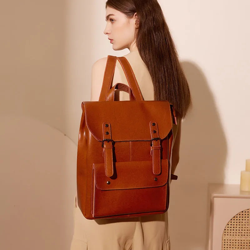 Genuine cowhide leather women's computer backpack in black, brown, or coffee colour.
