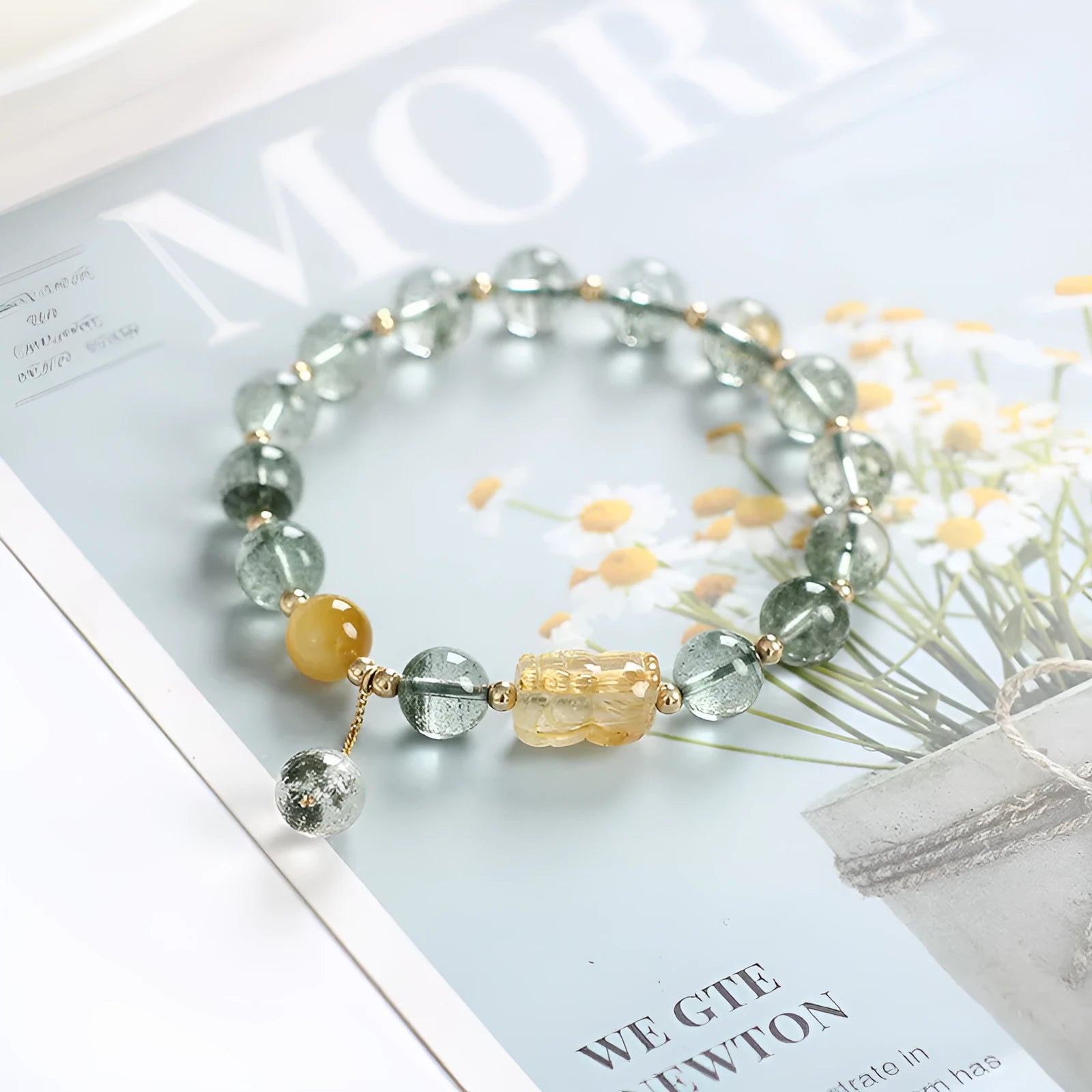 Green phantom quartz bracelet with gold rutile inclusions and geometric ethnic design