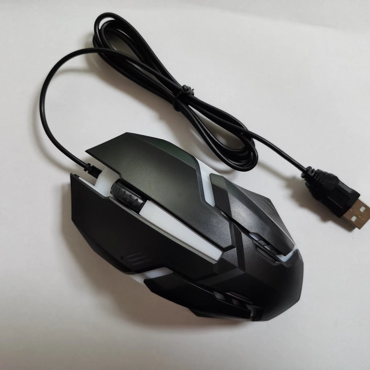 Wired USB photoelectric mouse with 1.35m cable for desktop, shown in black ribbon colour packaging or white