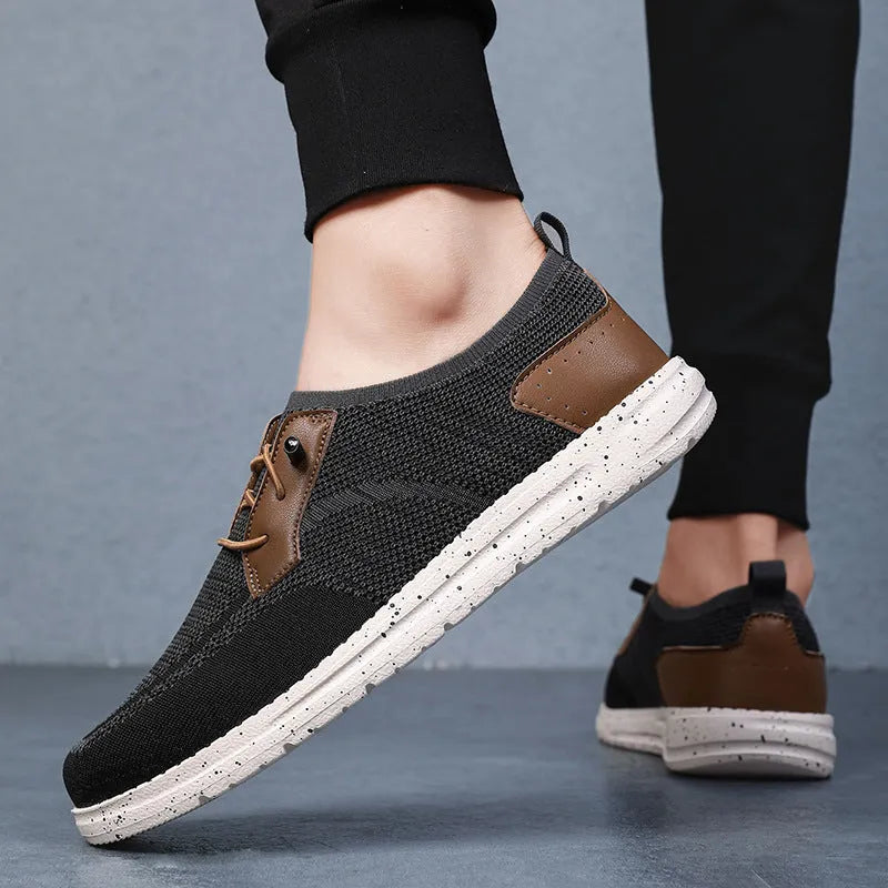 Men's black laceless canvas shoes with low-top design and round toe