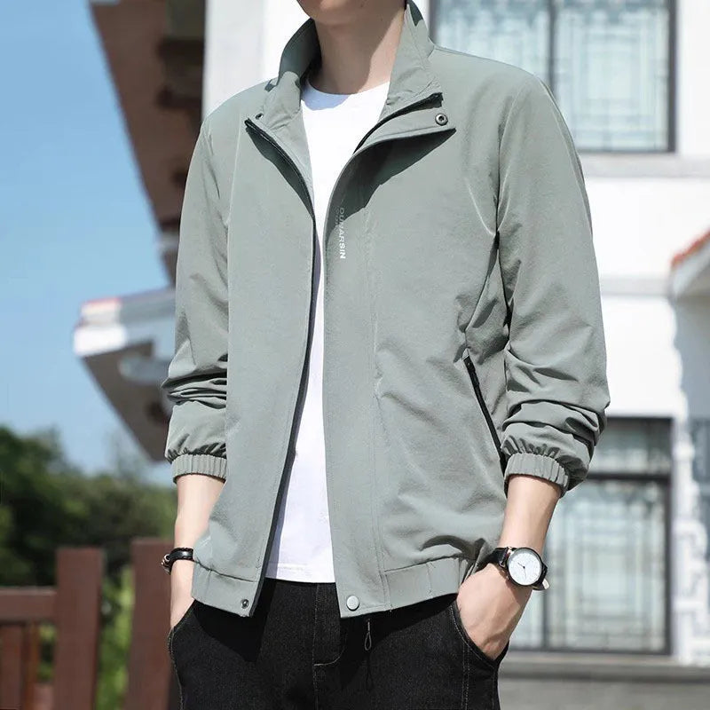 Men's black stand collar casual sports coat with straight hem and long sleeves on a hanger.