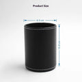 Round black leather pen holder with 8.0cm diameter on desk
