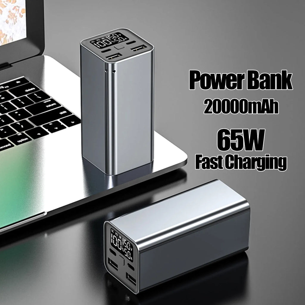 65W metal laptop power bank in black, blue, or grey colours showing size next to a laptop.
