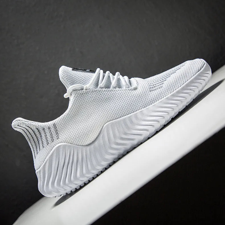 Men's breathable ultra-light running shoes with white upper and grey sole, side view