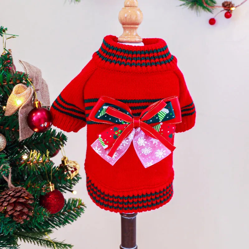 Red 'Merry Christmas' knitted jumper on a small dog, showing festive pattern and full-body fit.