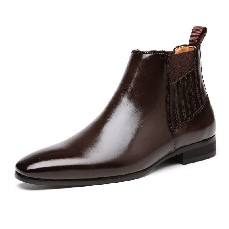 Stylish pointed-toe Chelsea boots for men in black and brown colors, featuring a square heel and sleek, British-inspired design.