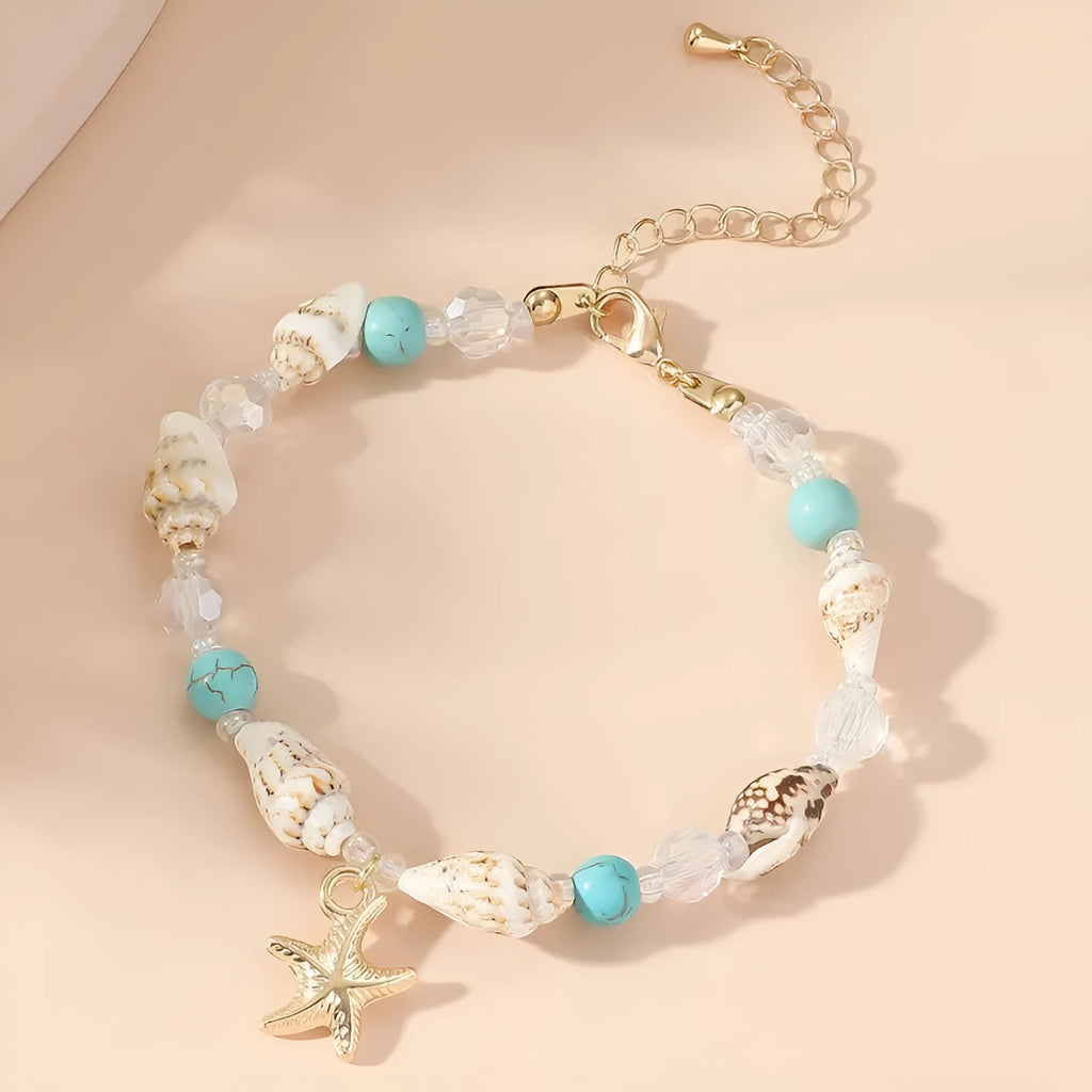 Alloy shell crystal beads bracelet with starfish pendant and conch beads on white background