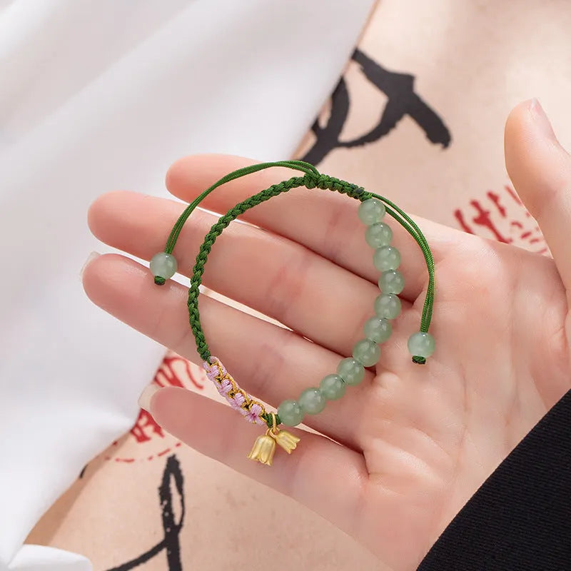 Red rope hand-woven bracelet with lily design and floral elements for women