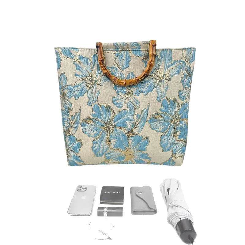 Light blue square canvas shoulder bag with gold bronzing flower pattern and double straps