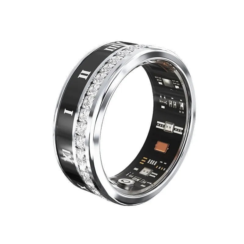 Gold and silver diamond inlaid smart ring for health and blood oxygen tracking on a finger.