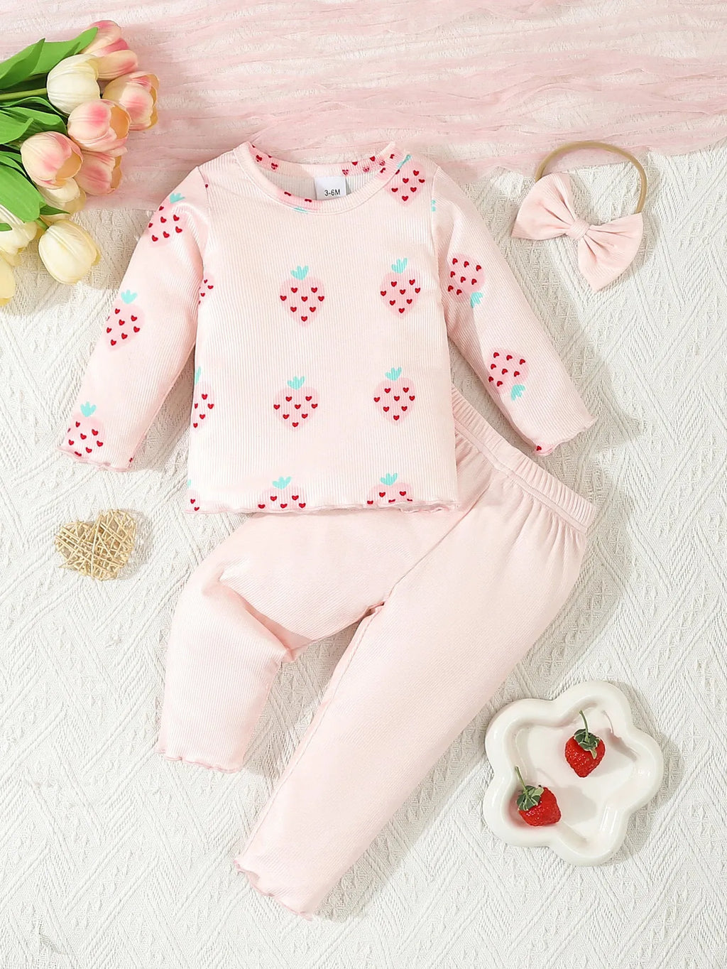 Infant wearing a printed long-sleeve top, solid trousers, and matching cap from the 3-piece suit set.