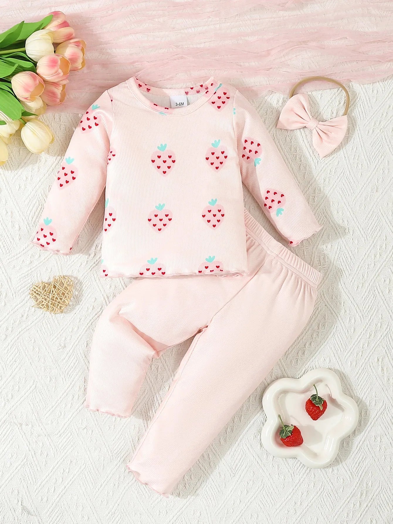 Infant wearing a printed long-sleeve top, solid trousers, and matching cap from the 3-piece suit set.