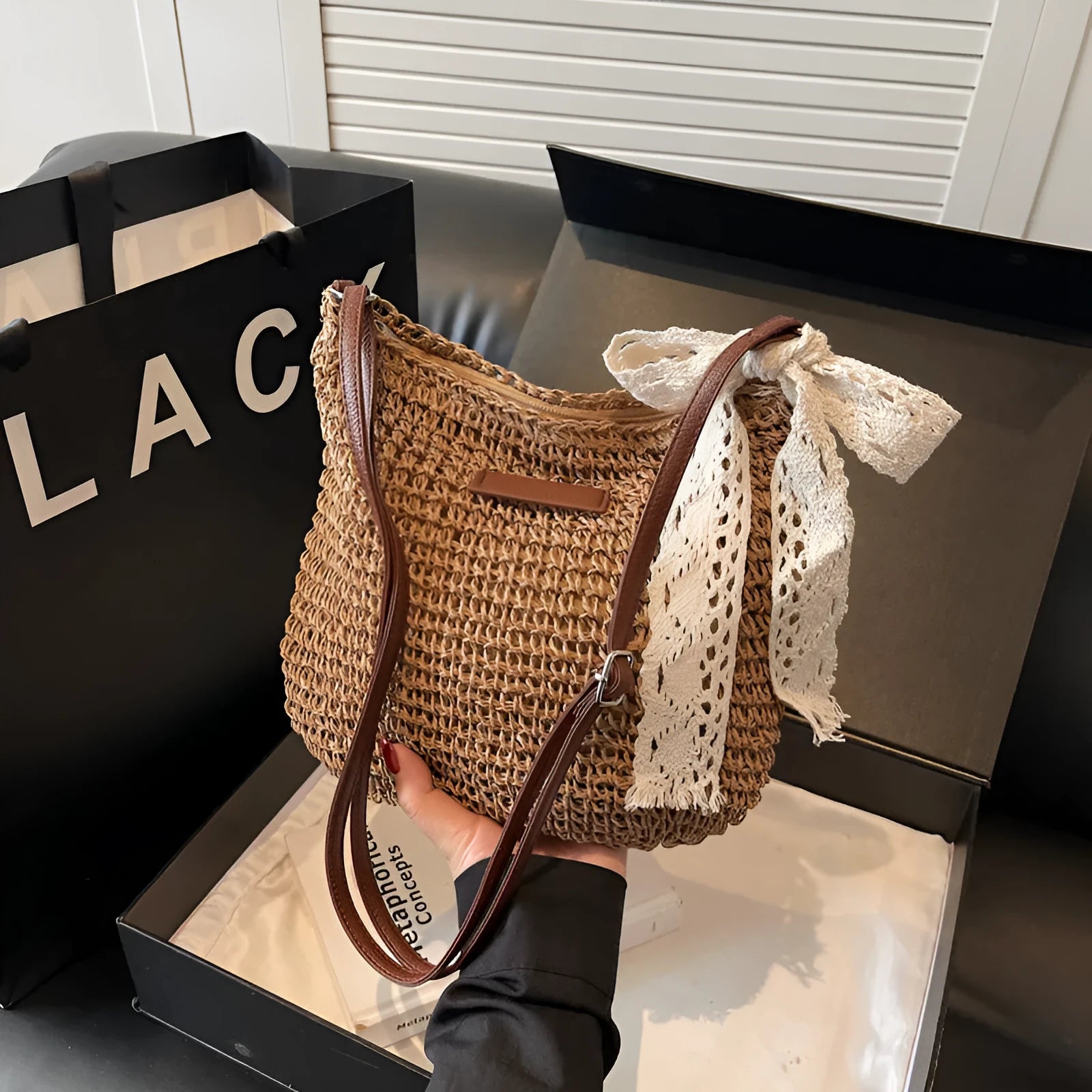 Women's woven straw messenger bag in khaki colour with shoulder strap