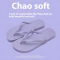 Orange and black flat beach slippers with hollow-out plastic uppers and textured non-slip PVC soles.