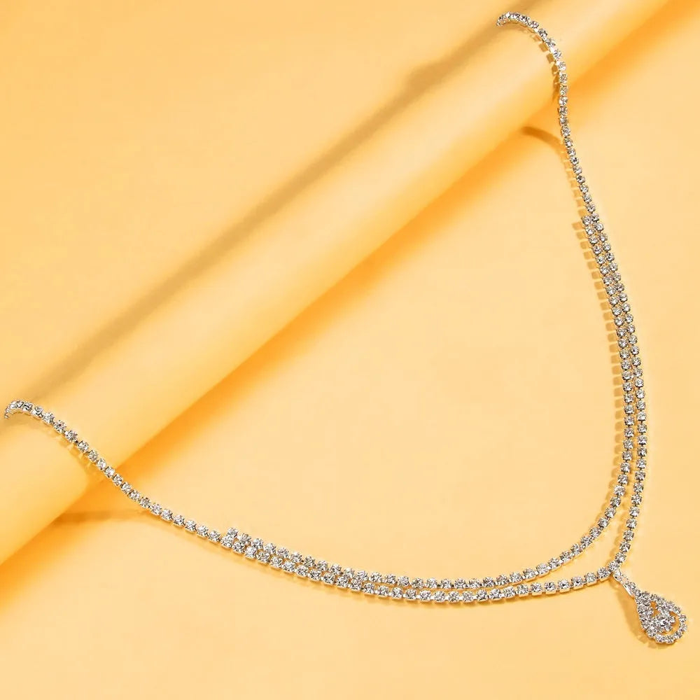 Gold water drop pendant waist chain with rhinestone decoration and lobster clasp