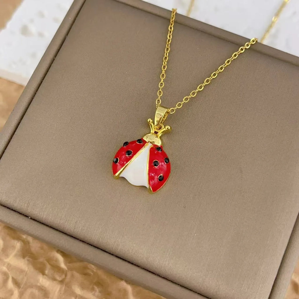 Ladybug pendant necklace with seven-spotted beetle charm, mixed gemstone inlay and copper O-link chain, 41-50cm.