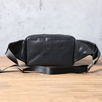 Men's small cowhide cross-body fanny pack in black, horizontal square shape, single shoulder strap