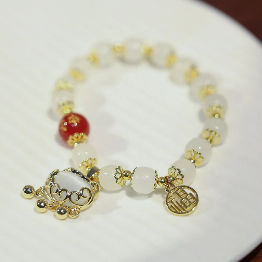 Women's Chinese style coloured glaze glass bracelet with safety lock, windmill, and bamboo charms