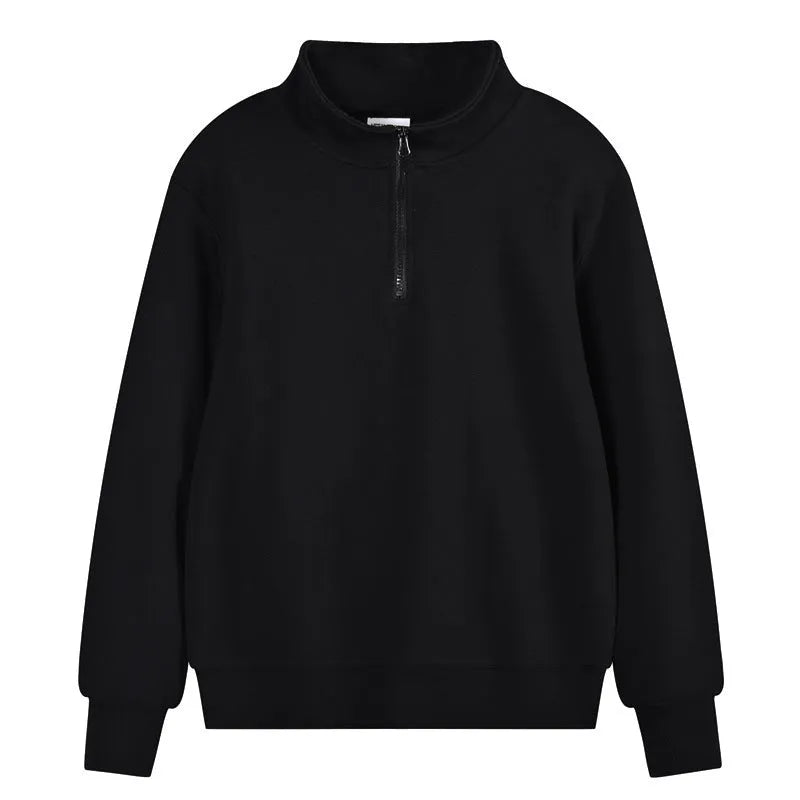 Man wearing a grey zip-front stand collar cotton sports sweater with a straight cut for casual wear.