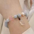 Women's handmade artificial crystal bracelet with gold-plated chain and charm pendant