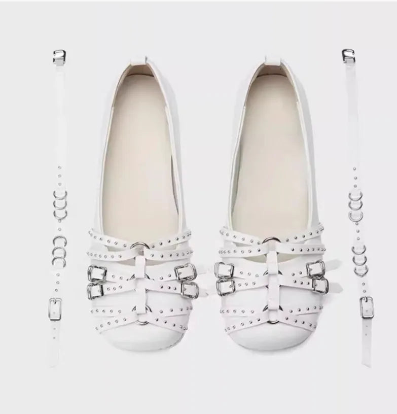 Women's black patent leather retro pumps with a square toe and silver buckle closure on a low rubber sole.