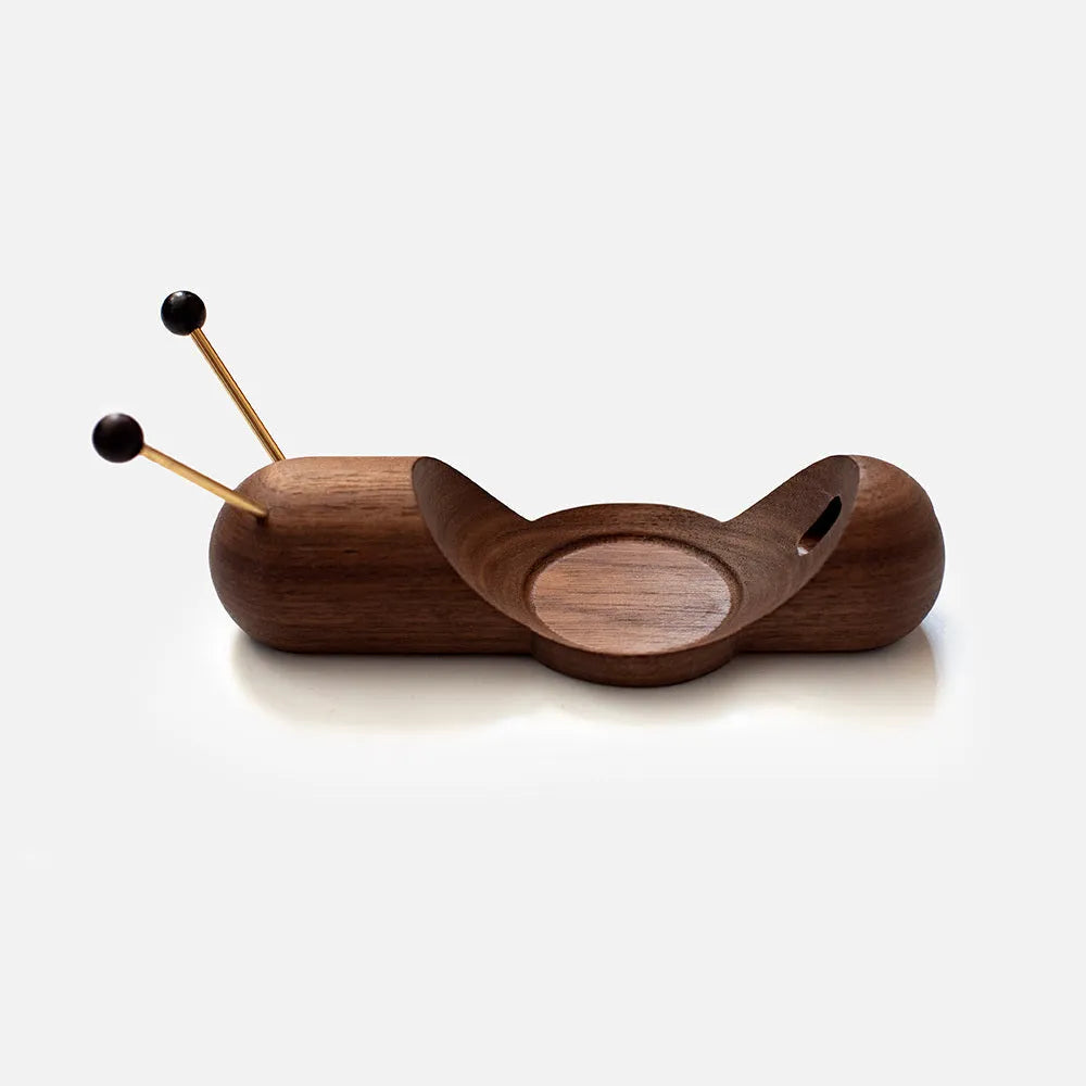 Khaki coloured non-slip desktop bracket for a smart Bluetooth speaker or HomePod.