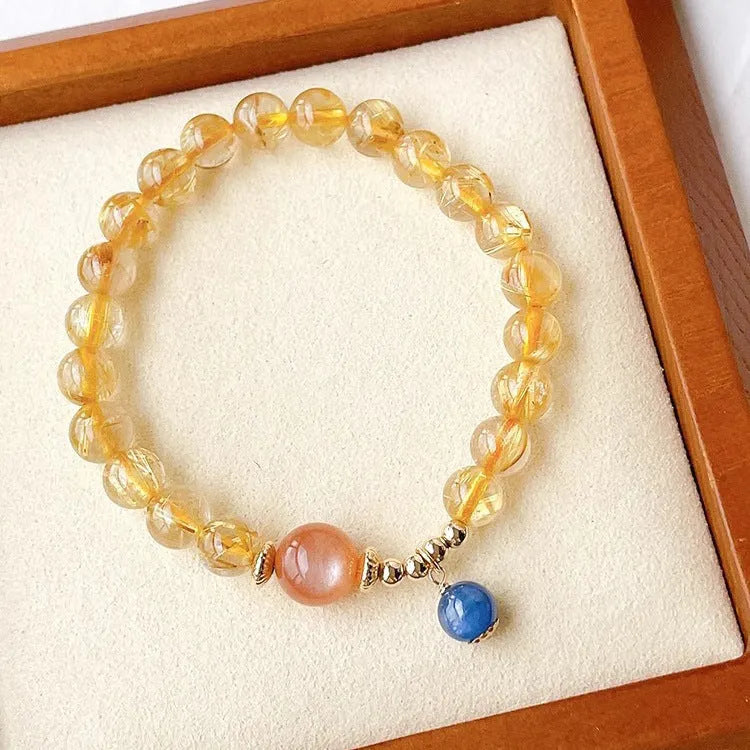 Gold rutilated quartz sunstone bracelet with round beads and diamond-shaped elements