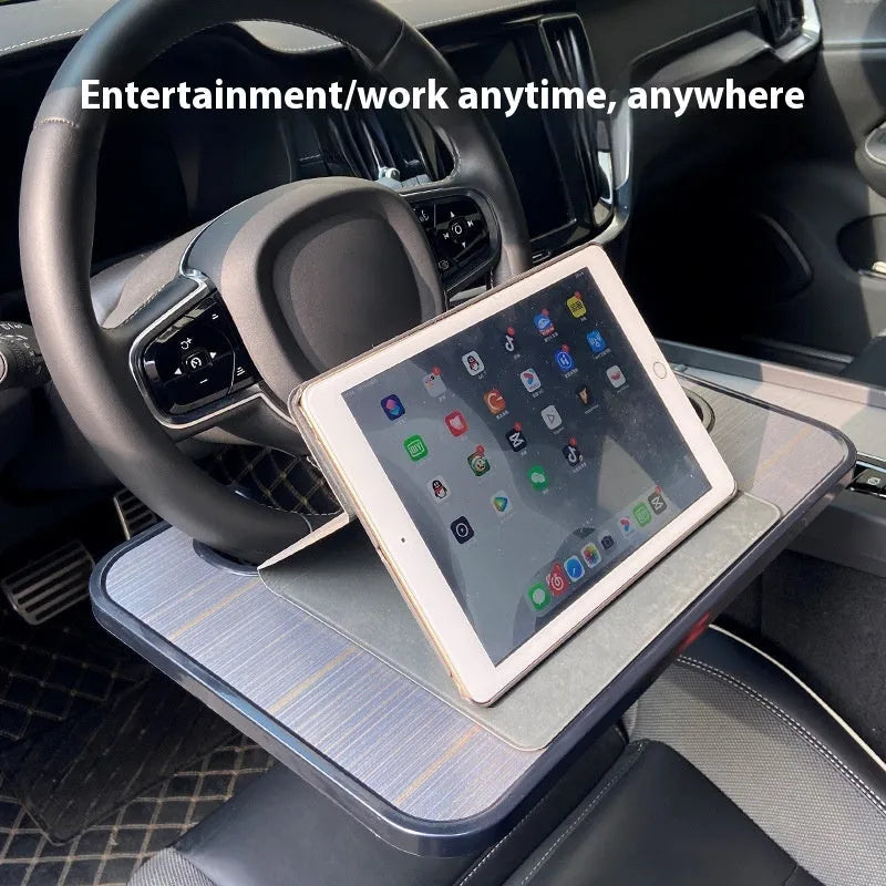 Multi-functional black ABS car steering wheel tray with foldable drink cup holder serving as a laptop stand.