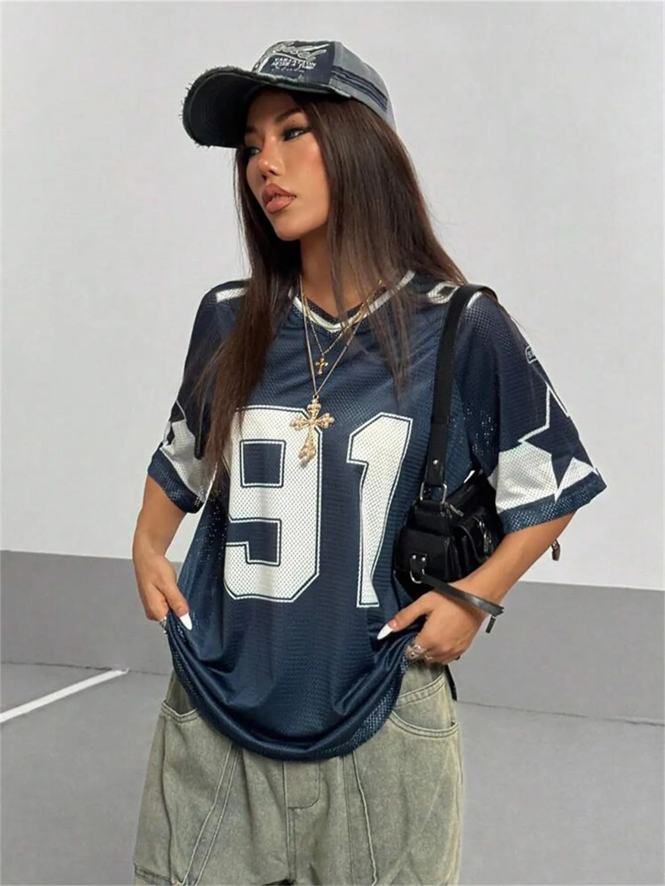 Men's loose fit t-shirt with large number print design, V-neck, and short sleeves in street style